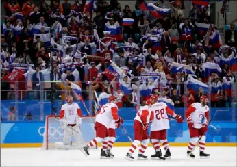  ?? PHOTO ?? Russian athlete Ilya Kovalchuk (right) celebrates with his teammates after scoring a goal against the Czech Republic during the third period of the semifinal round of the men’s hockey game at the 2018 Winter Olympics in Gangneung, South Korea, on Friday. Olympic Athletes from Russia won 3-0. AP