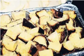  ?? PHOTOS BY LIONEL ROOKWOOD/PHOTOGRAPH­ER ?? Roasted yam made for a sweet side dish!