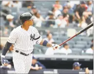  ?? Al Bello / Getty Images ?? The Yankees’ Gleyber Torres hits a two-run homer against the Padres on Wednesday.