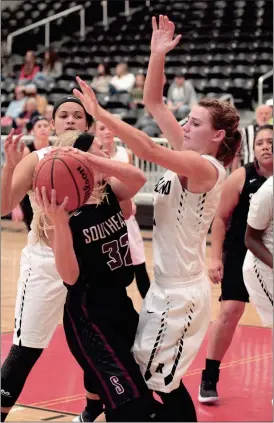  ??  ?? Ridgeland’s Brylee Dunn traps Southeast’s Sarah Sullivan during their game in the Chattooga Christmas Tournament this past Friday. (Messenger photo/ Scott Herpst)