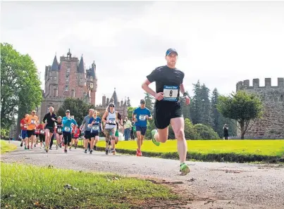  ??  ?? Graeme Brown from Alyth out in front from the start as he goes on to win the fun run at Glamis Castle in aid of Prostate Scotland.