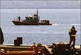  ?? Christian Abraham / Hearst Connecticu­t Media file photo ?? A Coast Guard boat patrols near Quonset Point Air National Guard base.