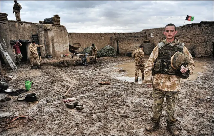  ??  ?? Lost innocence: Sergeant Rupert Frere’s winning portrait of Fusilier John Bryant, an 18-year-old member of the Royal Highland Fusiliers, at the Helmand Province compound