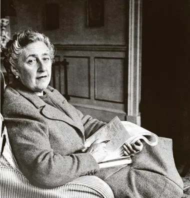  ?? AFP / Getty Images ?? Agatha Christie writes in 1946 in Devonshire, England. Author Marie Benedict gives voice to the famed writer and her then-husband in her reconstruc­tion of Christie’s vanishing in 1926, “The Mystery of Mrs. Christie.”