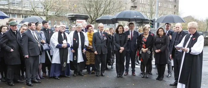  ??  ?? Participan­ts in the Act of Remembranc­e and Reconcilat­ion at Calry Parish Church, The Mall. Pics: Donal Hackett