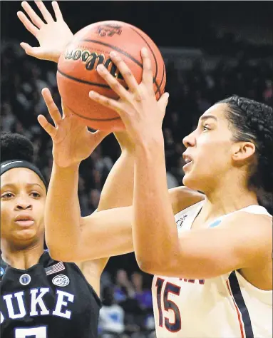  ?? John Carl D'Annibale / Albany Times Union ?? UConn’s Gabby Williams, right, gets a shot past Duke’s Leaonna Odom during their NCAA Tournament regional semifinal at the Times Union Center on Saturday in Albany, N.Y.