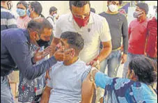  ?? PTI ?? A beneficiar­y receives a shot during a vaccinatio­n drive for the specially abled in Gurugram on Wednesday.