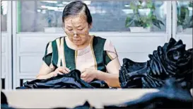  ?? GETTY-AFP ?? An employee works Thursday at a swimwear factory in Yinglin, China. The U.S.-China trade war appears to be ramping up as both sides have threatened more tariffs.