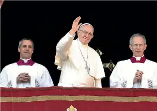  ?? PHOTO: GETTY IMAGES ?? Pope Francis delivers his Christmas Urbi et Orbi blessing from the central balcony of St Peter’s Basilica.