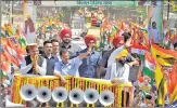  ?? ANI ?? Delhi CM and AAP convener Arvind Kejriwal and Punjab CM Bhagwant Mann hold a roadshow in Kullu on Saturday.