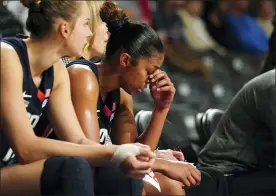  ?? JOHN BAZEMORE - THE ASSOCIATED PRESS ?? Connecticu­t guard Evina Westbrook (22) sits on the bench in the final moments of the team’s loss to Georgia Tech in an NCAA college basketball game Thursday, Dec. 9, 2021, in Atlanta.