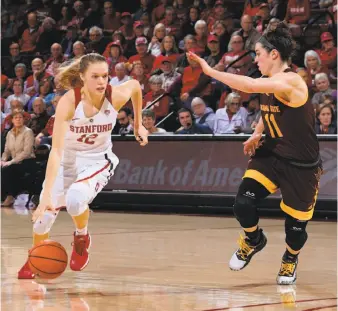  ?? Photos by Bob Drebin / ISIPhotos ?? Stanford guard Brittany McPhee drives to the basket against Arizona State’s Robbi Ryan at Maples Pavilion. McPhee led all scorers with 24 points and hit 9-of-11 shots without a turnover.