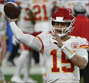  ?? DAVID BECKER - THE ASSOCIATED PRESS ?? Kansas City Chiefs quarterbac­k Patrick Mahomes (15) warms up before an NFL football game against the Las Vegas Raiders, Sunday, Nov. 22, 2020, in Las Vegas.