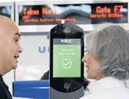  ?? DAVID J. PHILLIP/AP ?? An agent helps a passenger navigate a facial recognitio­n kiosk at a United Airlines gate before her flight to Tokyo.