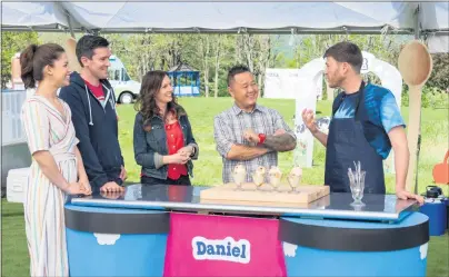  ?? COURTESY OF FOOD NETWORK ?? Host Molly Yeh, left, and judges Chris Rivard, Allison Tila and Jet Tila sample contestant Daniel Levine’s dish, oatmeal cookie crunch ice cream, during the Mini Scoop Challenge judging on “Ben & Jerry’s: Clash of the Cones.” The series premieres Monday on Food Network.