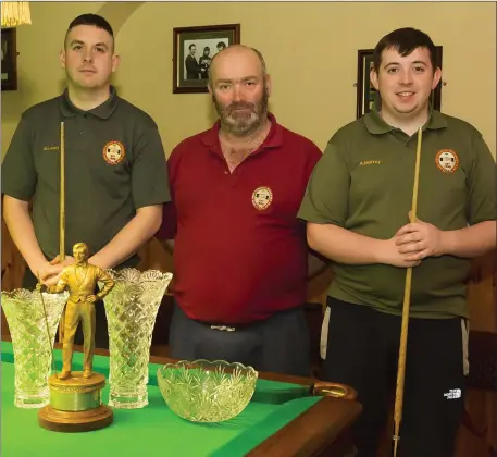  ??  ?? Mark Lacey (left), winner of the New Ross Workmen’s Club open snooker final, with Liam Connolly (referee) and Alan Murray (runner-up).