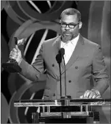  ?? CHRIS PIZZELLO/INVISION ?? Jordan Peele accepts the award for best director at the Independen­t Film Spirit Awards on Saturday.