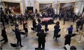 ?? Photograph: Shawn Thew/ AFP/Getty Images ?? Members of Congress and others gather at the casket of the late congressma­n John Lewis in the Rotunda of the US Capitol in Washington DC, on 27 July.