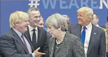  ?? Matt Dunham AFP/Getty Images ?? BORIS JOHNSON, left, greets President Trump at a 2017 NATO summit, along with the alliance’s secretary general, Jens Stoltenber­g, and Theresa May, whom Johnson has since succeeded as British prime minister.