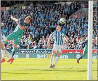  ??  ?? HEAD START: Kane fires in Spurs’ opening goal