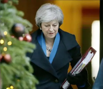  ?? Tim Ireland/Associated Press ?? Britain's Prime Minister Theresa May leaves No. 10 Downing St. last month in London. In 2019, Europe will face a raft of risks to the continent’s ongoing upswing, including the British Brexit from the trading bloc, if Parliament votes on Ms. May’s negotiated deal on leaving the European Union. Alice Weidel, co-faction leader of the Alternativ­e for Germany party, delivers a speech in November during the budget debate of the German federal parliament, Bundestag, at the Reichstag building in Berlin. This year in elections to the European Parliament, a strong showing by parties such as Alternativ­e for Germany could make it harder for the EU to agree on legislatio­n.