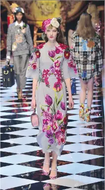  ?? GIUSEPPE CACACE/AFP/GETTY IMAGES ?? It’s usually better to stick to one bouquet-covered item rather than a headto-toe floral look.