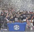  ?? KEN RUINARD/USA TODAY NETWORK ?? South Carolina players celebrate winning the SEC women’s title Sunday.