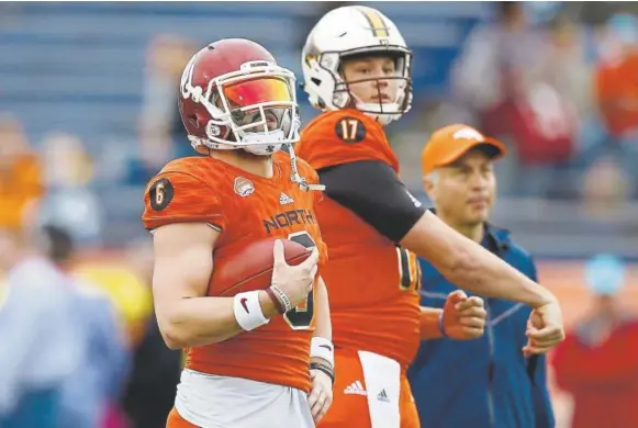  ?? Jonathan Bachman, Getty Images ?? Potential Broncos draft selections, from left, Oklahoma’s Baker Mayfield and Wyoming’s Josh Allen bring a mix of risk and reward should Denver opt to use its No. 5 pick on one of them.