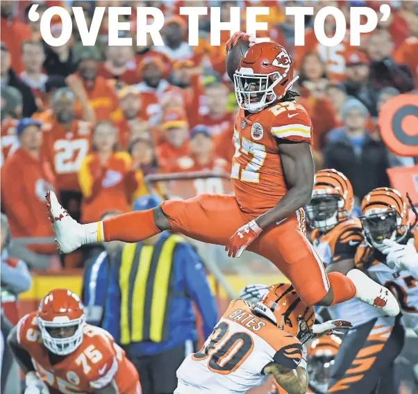  ?? REED HOFFMANN/AP ?? The Chiefs’ Kareem Hunt hurdles Bengals safety Jessie Bates after spinning out of one tackle, charging forward and breaking two other tackles.