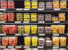  ?? DREAMSTIME ?? Pre-sliced fruits are on display in a grocery store. On Tuesday, the CDC reported 70 cases of salmonella infections in seven states tied to pre-cut melons, with 34 hospitaliz­ations.