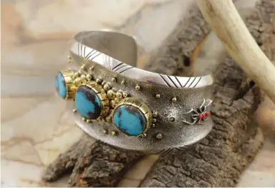  ??  ?? 1. Philander Begay (Navajo), 14k gold/sterling silver Bisbee blue turquoise traditiona­l bracelet. Courtesy Manitou Galleries.
2. Ben Nighthorse (Northern
Cheyenne), multi-colored circle bracelet, sterling silver and gemstones. Courtesy Sorrel Sky Gallery.