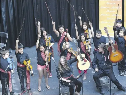  ?? ED KAISER ?? The Prince Charles Fiddlers wrap up their performanc­e during a National Aboriginal Day kickoff event at Edmonton City Centre Monday. Aboriginal Day is Wednesday. The nationwide event celebrates the unique heritage, diverse cultures and outstandin­g...