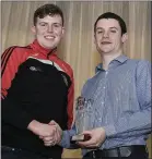  ??  ?? Kelvin O’Connor, Banteer, receives the Best Male Performer from Alan Twomey, Chairman, Muskerry Macra.