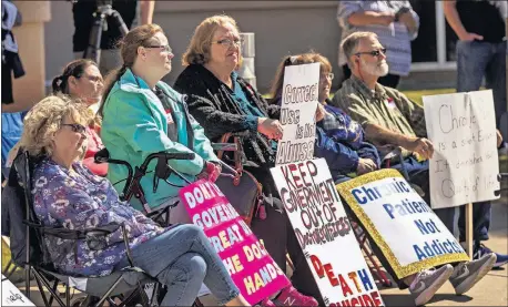  ??  ?? Protesters take part in a rally on Wednesday outside the Oklahoma attorney general's office.