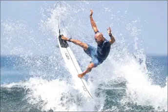  ?? — AFP photo ?? File photo shows Kelly Slater of the US performs a manoeuvre on a wave during the World Surf league men’s championsh­ip tour surfing event at Keramas in dianyar on Indonesia’s resort island of Bali.