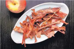  ?? DEB LINDSEY/FOR THE WASHINGTON POST ?? Apple peels are slow-baked until they transform into light, crispy chips.