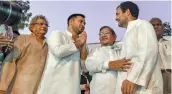  ?? — PTI ?? RJD leader Tejashwi Prasad Yadav greets Congress President Rahul Gandhi at the protest.