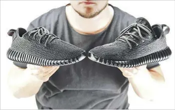  ?? Kirk McKoy Los Angeles Times ?? CAN YOU SPOT the replica? The shoe on the left is an authentic Yeezy, one in a line of popular sneakers designed by rapper Kanye West. Counterfei­ts, like the shoe on the right, can be bought discreetly online.