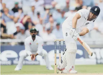  ??  ?? Alastair Cook times his shot superbly off his legs for the two which brought up his 29th Test century