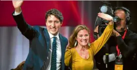  ?? —AFP ?? FRESH TERM Prime Minister Justin Trudeau celebrates with his wife Sophie after winning a second term.