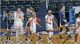  ?? RONALD CORTES — THE ASSOCIATED PRESS ?? Georgia players reach out to teammate Que Morrison (23) after a basket during the first half of a college basketball game in the first round of the women’s NCAA tournament at the Greehey Arena in San Antonio, Texas, Monday, March 22, 2021.