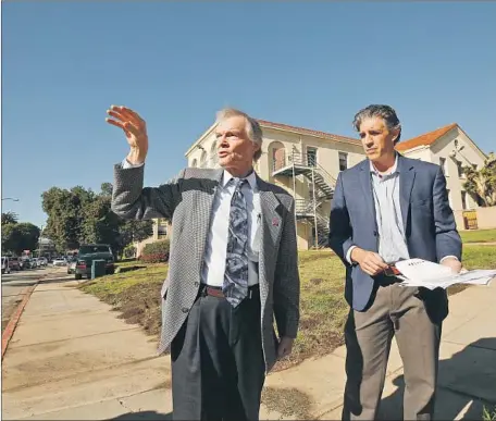  ?? Al Seib Los Angeles Times ?? STEPHEN PECK, left, chief executive of the veterans-services nonprofit U.S. Vets, and Brian D’Andrea, a senior vice president at Century Housing, discuss the proposed housing for homeless veterans at Building 207 of the West Los Angeles Veterans Affairs campus.