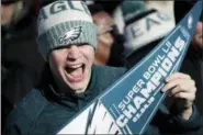  ?? JULIO CORTEZ - THE ASSOCIATED PRESS ?? A Philadelph­ia Eagles fan chants while waiting for the team to arrive in Philadelph­ia at Philadelph­ia Internatio­nal Airport a day after defeating the New England Patriots in Super Bowl 52in Minneapoli­s, Monday, Feb. 5, 2018.