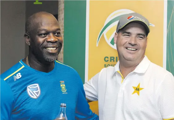  ?? Picture: Gallo Images ?? LEADERS OF THE PACK. Proteas coach Ottis Gibson (left) and his Pakistan counterpar­t Mickey Arthur share a light moment after the visitors’ arrival for their upcoming tour yesterday.