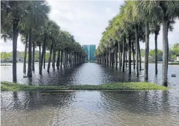  ?? JOE CAVARETTA/STAFF PHOTOGRAPH­ER ?? With its pedestrian walkway and parking lots flooded, Sawgrass Mills mall in Sunrise remained closed Thursday.