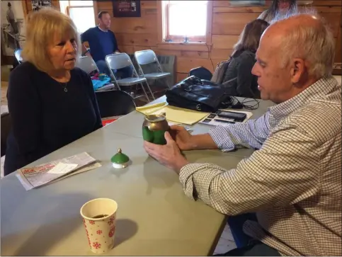  ?? GLENN GRIFFITH MEDIANEWS GROUP ?? Jean Greenspan listens as appraiser George Heigel tells her about an English coffee pot she brought to last week’s Antique Appraisal Fair in the Historic Grooms Tavern