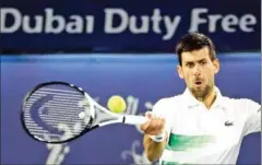  ?? AFP ?? Serbia’s Novak Djokovic returns the ball to Czech Republic’s Jiri Vesely during their quarter-final match at the ATP Dubai Duty Free Tennis Championsh­ip on February 24.