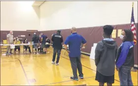  ?? EVAN BRANDT — MEDIANEWS GROUP ?? Upper Pottsgrove voters at Pottsgrove Middle School maintained social distancing while waiting to get their ballots on Tuesday, June 2.