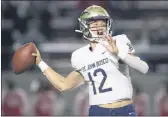  ?? PHOTO BY KYUSUNG GONG ?? St. John Bosco quarterbac­k Katin Houser, a Michigan commit, will share duties with Pierce Clarkson, a junior, again after a successful spring season.