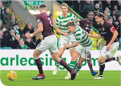  ??  ?? Celtic’s James Forrest drives home to make it 4-0 celtic: (4-2-3-1) Gordon 7; Lustig 6 (Ajer 58 6), Boyata 7, Benkovic 7, Tierney 6; McGregor 9, Christie 7; Forrest 7, Rogic 7, Sinclair 6 (Morgan 80 5); Eduoard 8 (Johnston 72 5). Unused – Bain (Gk), Hendry, Hayes, McInroy. hearts: (4-4-2) Zlamal 5; Smith 6, Dikamona 5, Dunne 6, Mitchell 5 (Garuccio 46 6); Haring 6, Clare 6 (Morrison 72 6); Djoum 6, Cochrane 7; Mulraney 5 (Wighton 81 5); MacLean 6. Unused – Doyle (Gk), Bozanic, Lee, Hughes.